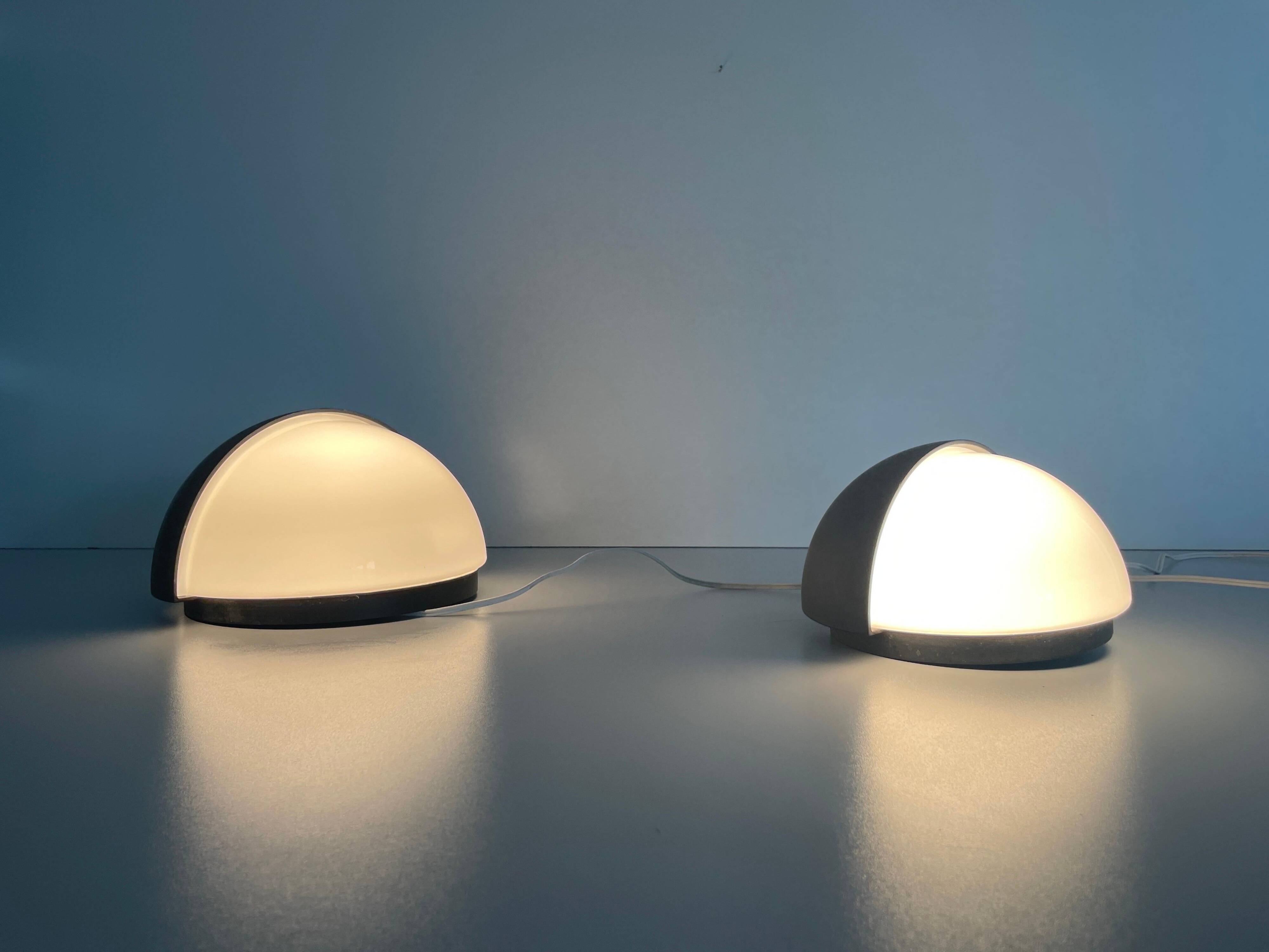Round black metal wall lights, small and large set, by Bega, 1970s, Germany.