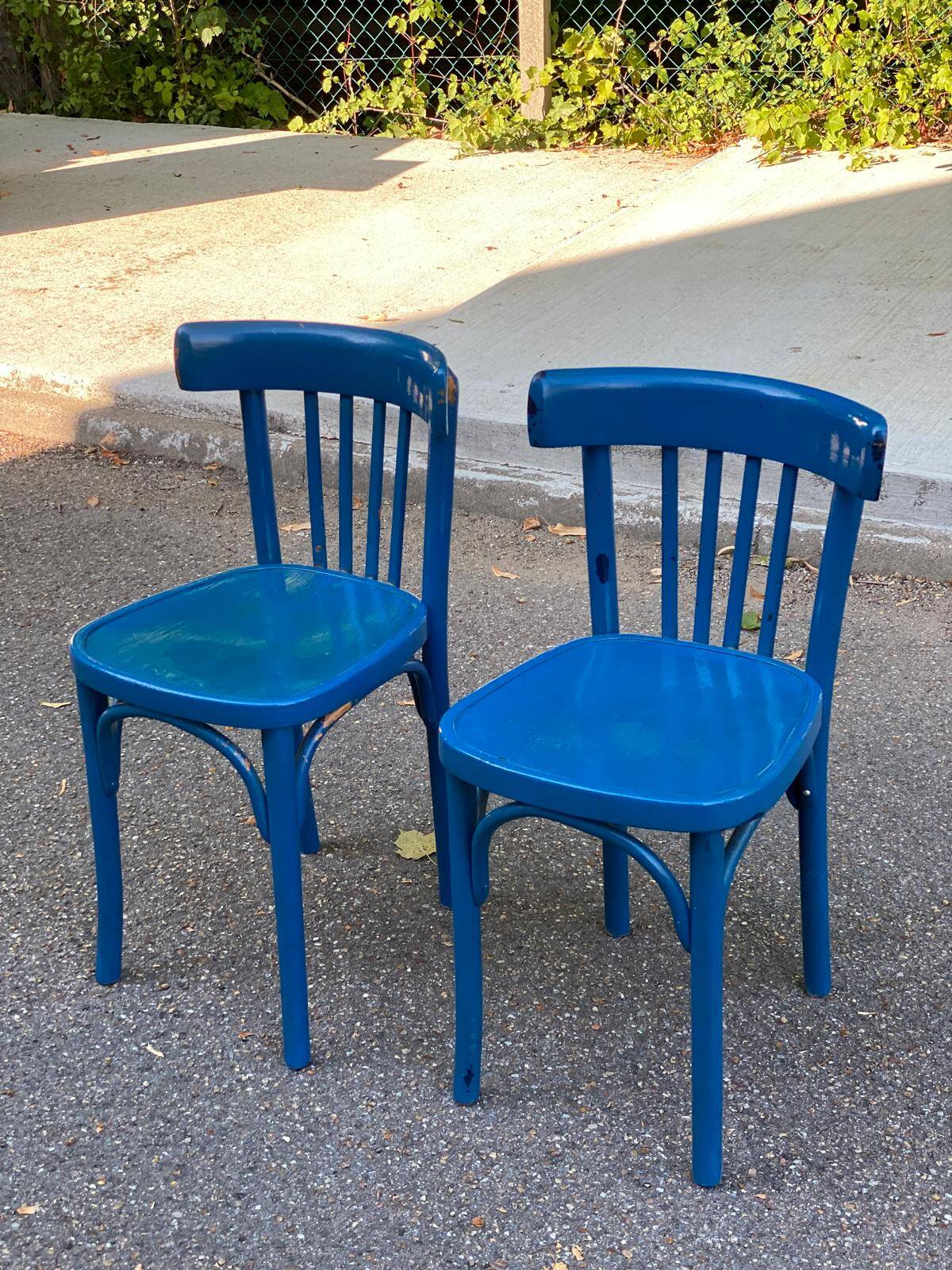 2 blue bistro chairs in curved solid wood