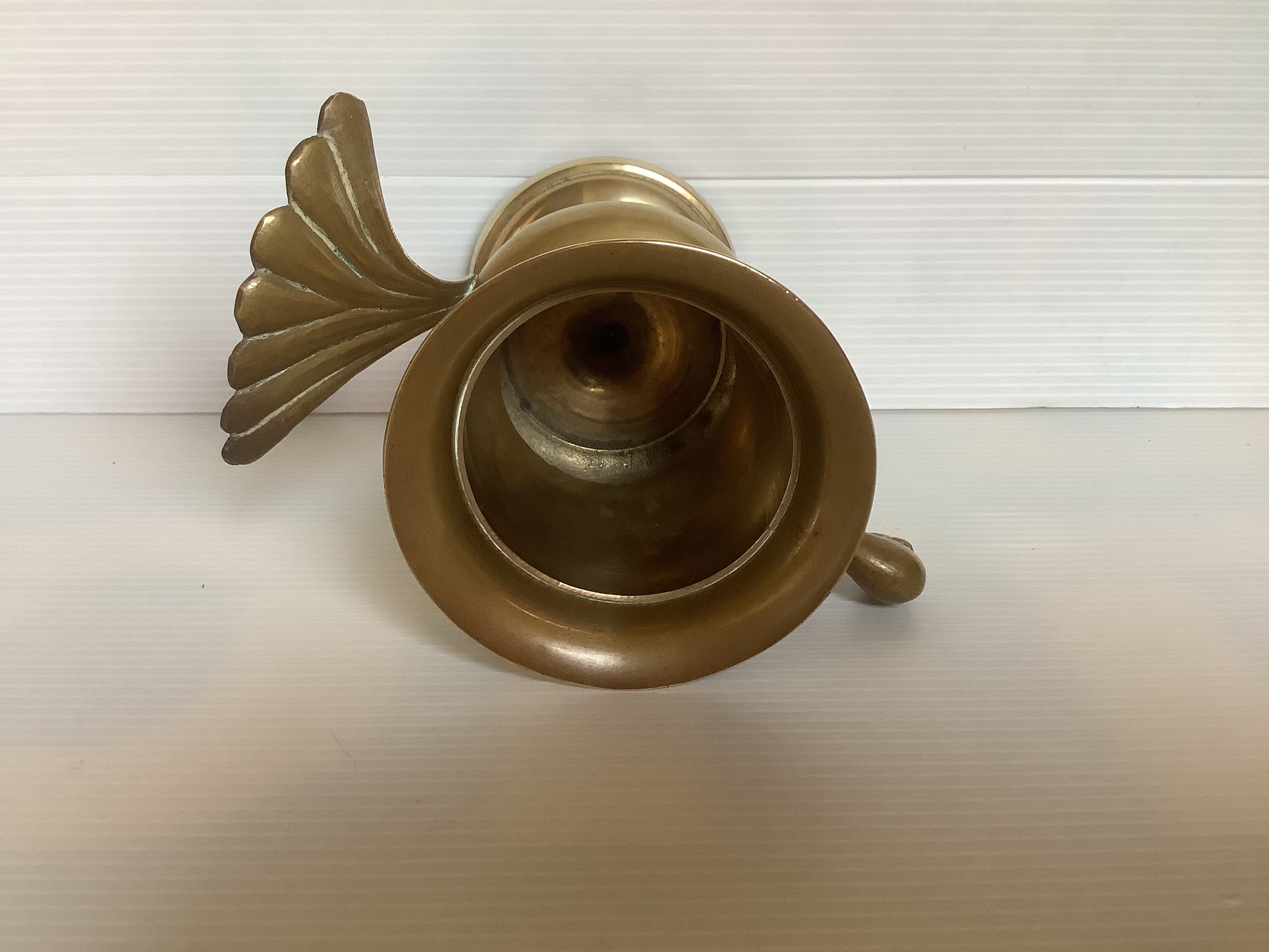 Empty brass bird pocket