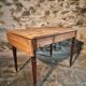 Vintage French pine table with extendable side, circa 1930, suitable for kitchen or office use.