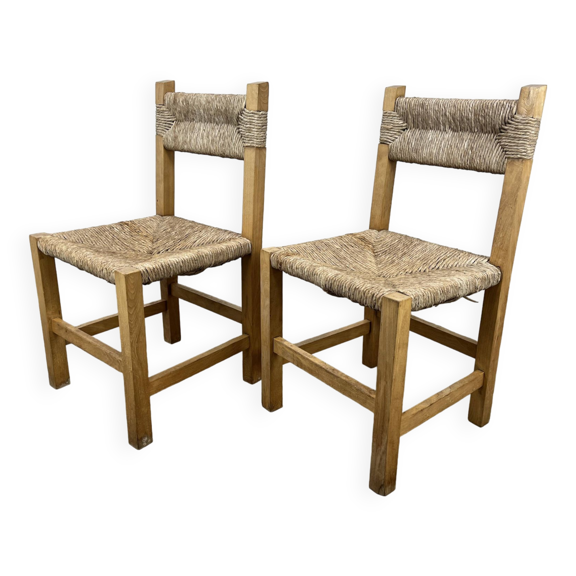 2 straw and wood chairs in brutalist style