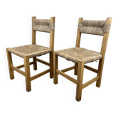 2 straw and wood chairs in brutalist style