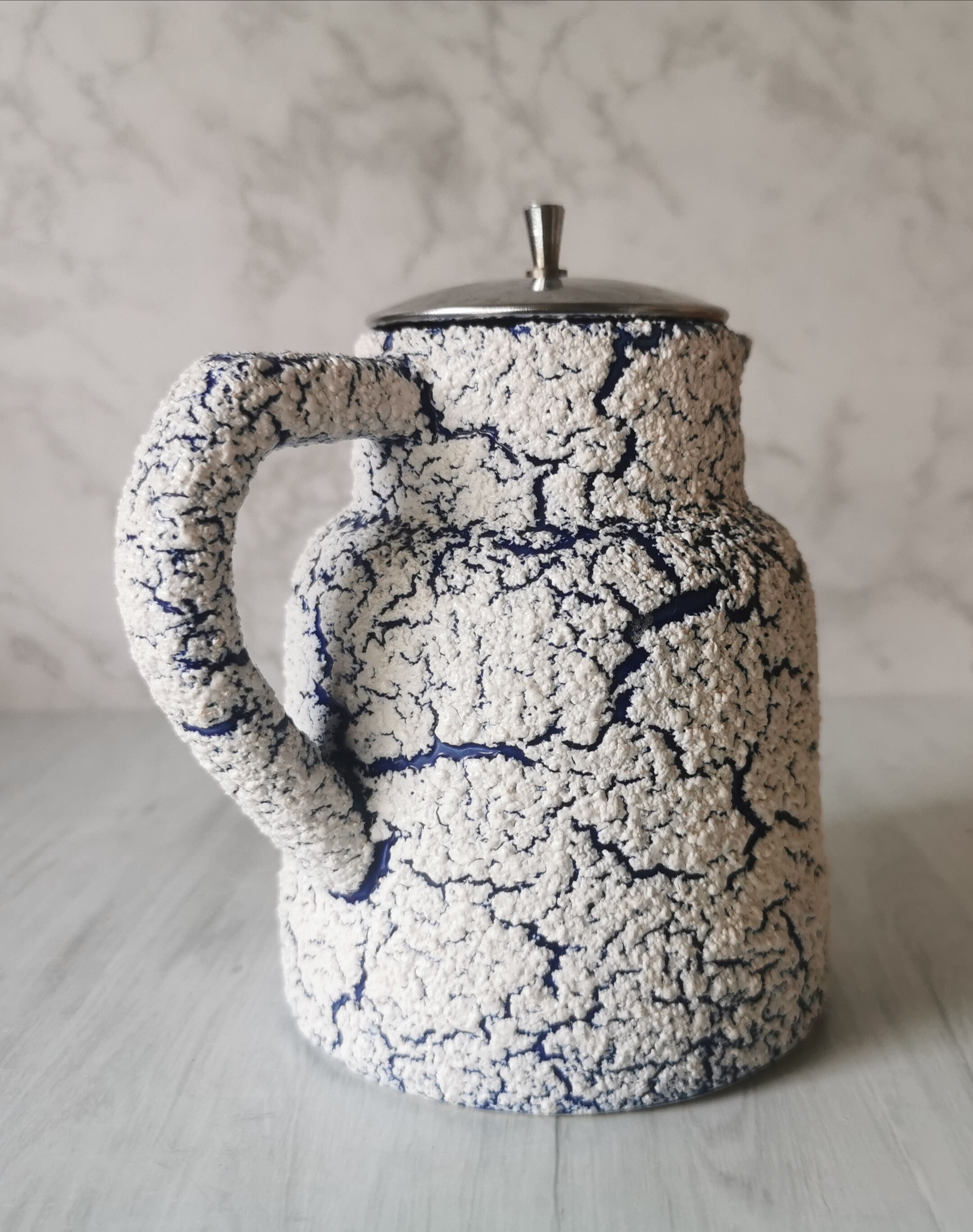 Cracked and enamelled ceramic teapot
