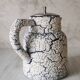 Cracked and enamelled ceramic teapot