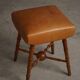 Turned wooden stool with leather seat, mid-20th century, Danish modern.