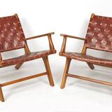PAIR OF TEAK AND LEATHER ARMCHAIRS