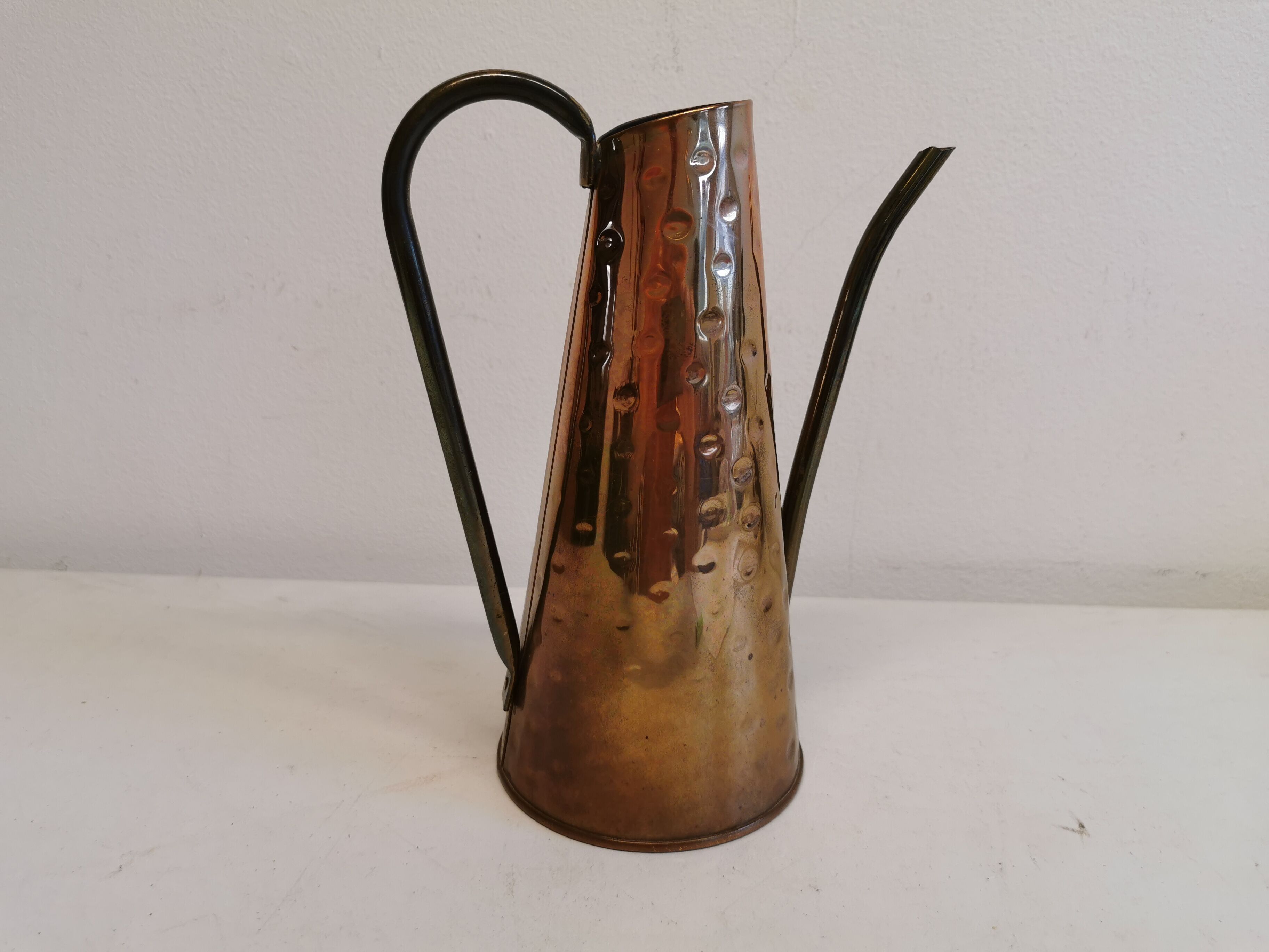 Watering can from the 1950s, made of hammered copper and brass