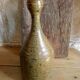 Bottled sandstone vase with a narrow neck