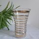 Vase with golden trim and lace-edged rim.