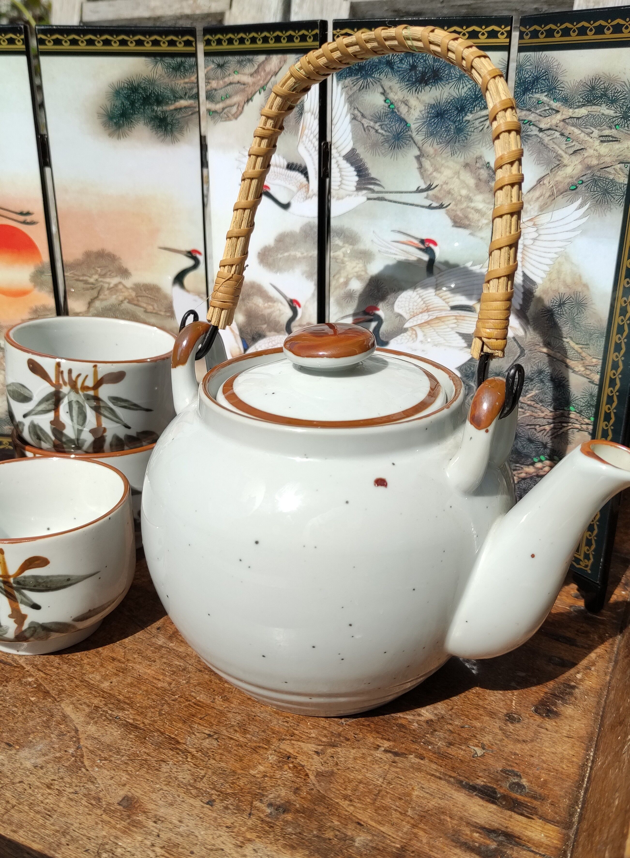 Asian set of a teapot and its cups