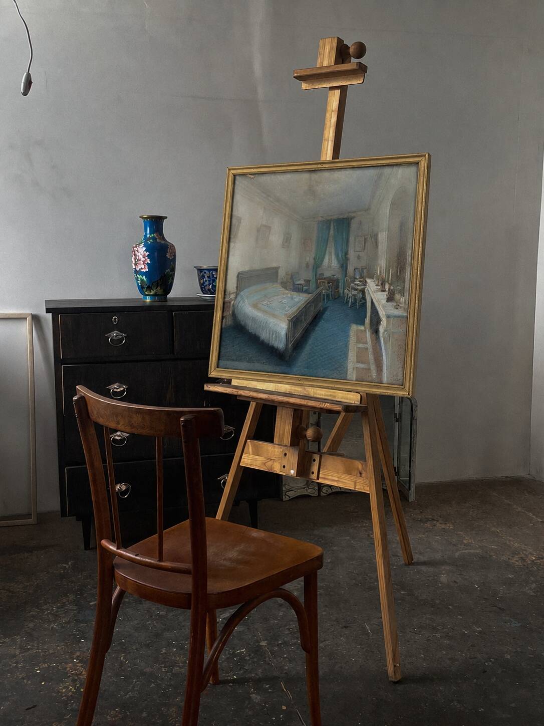A painting depicting a 19th-century bedroom signed by Jean Victor Fossier.