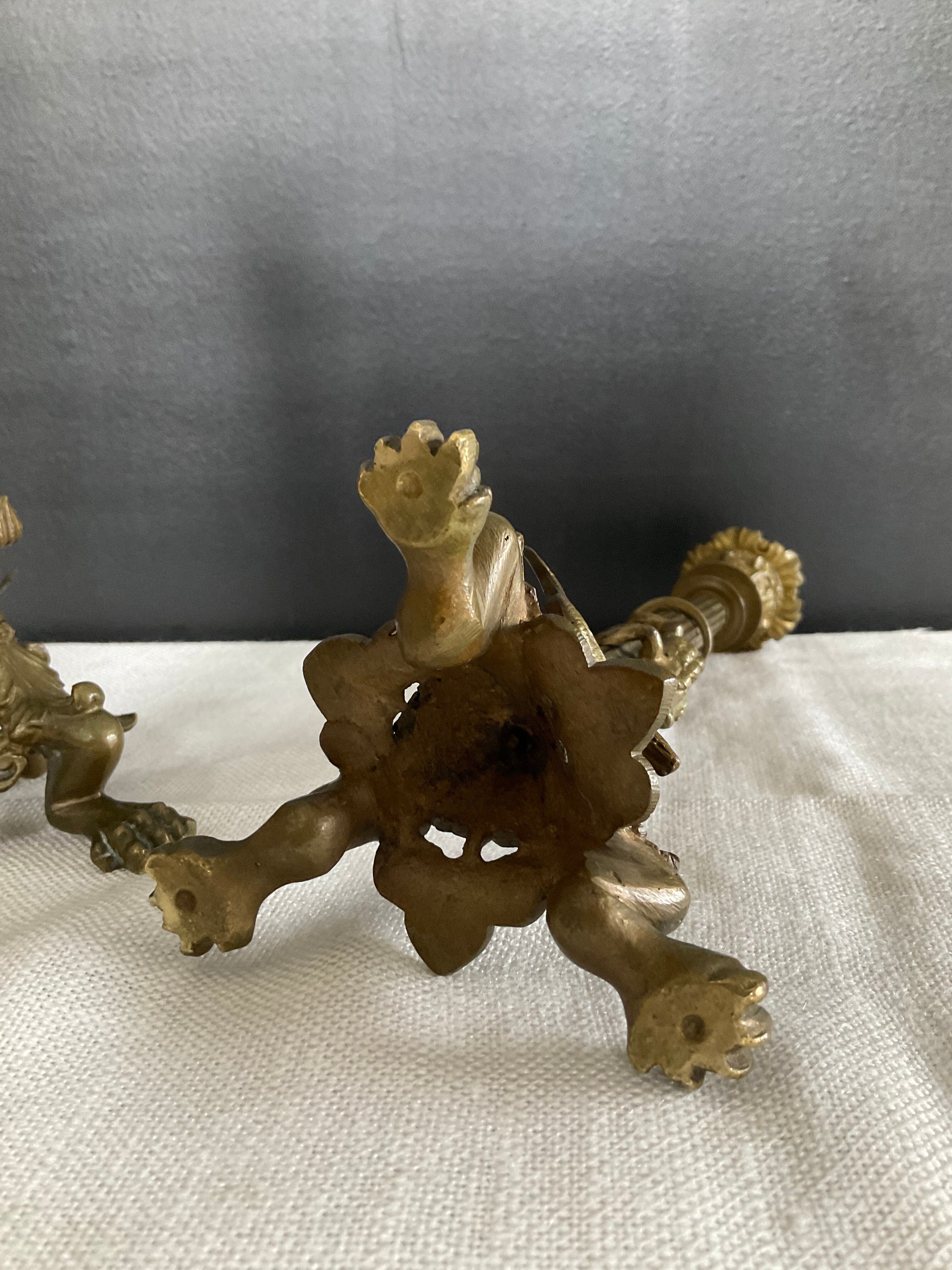 Pair of 19th-century gilded bronze candlesticks in Empire style.