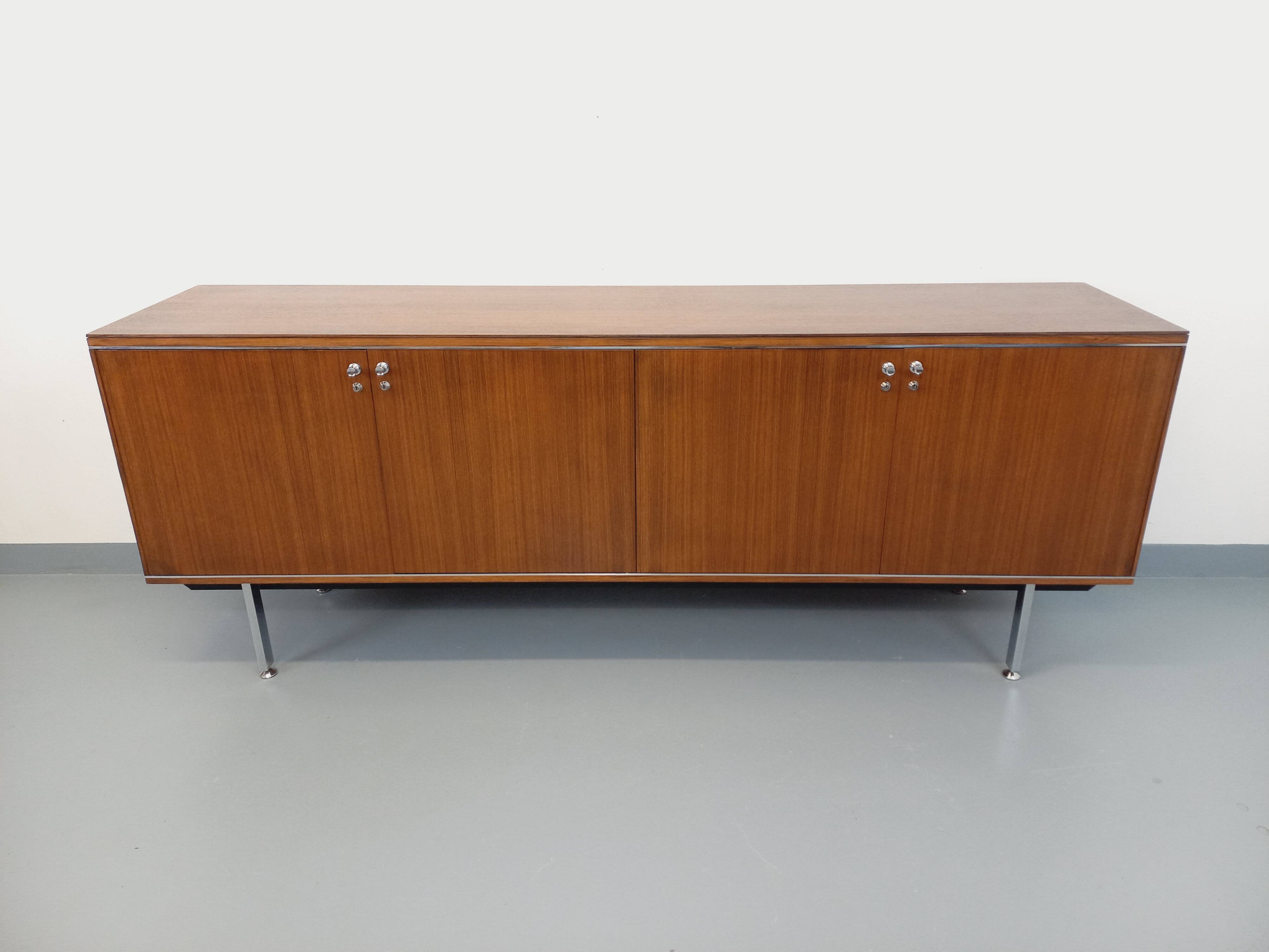 Vintage modernist enfilade in rosewood and chrome metal from the 60s and 70s.