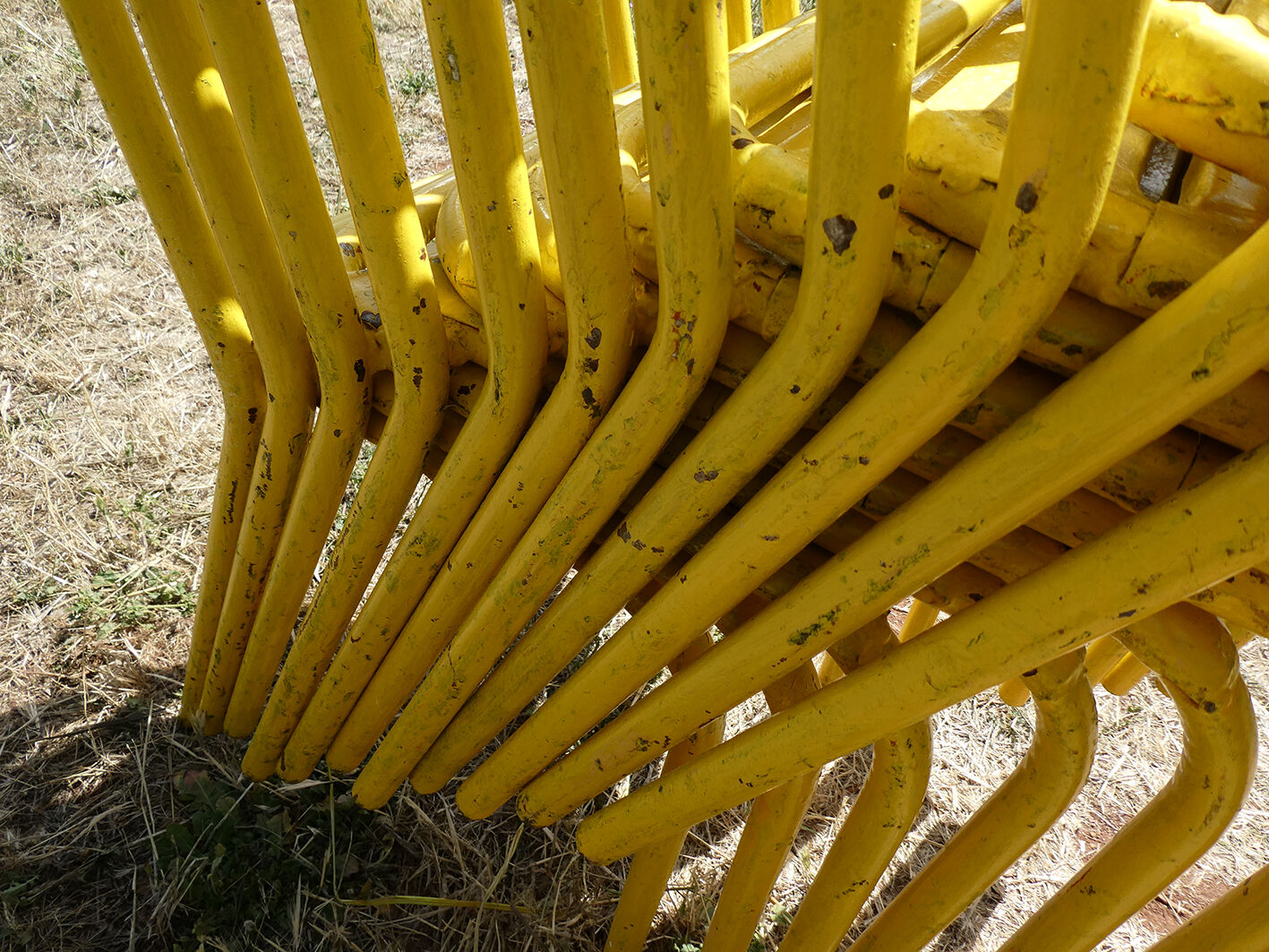 Lot of 11 yellow metallic bistro chairs from the 1950s