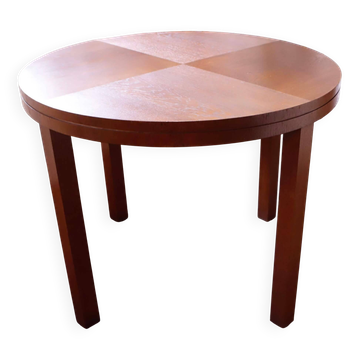 Round dining table from the 1960s with a veneered top