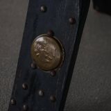 Dark red upholstered camel saddle stool, 20th century, North Africa.