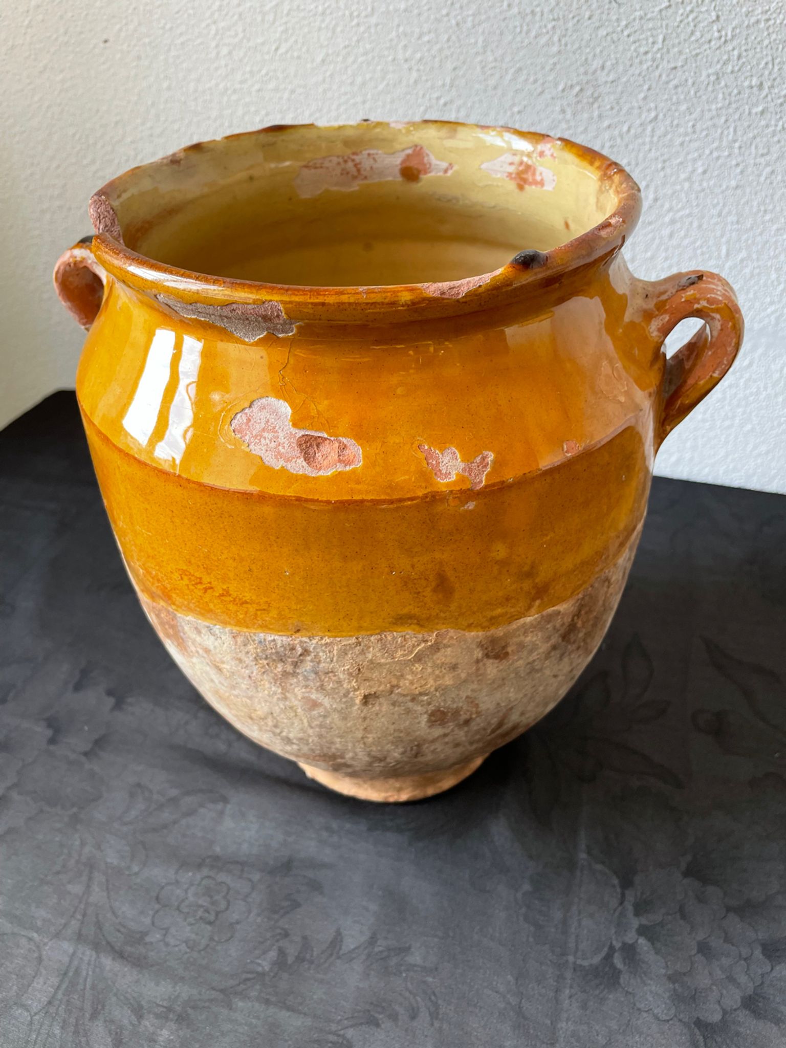 Old grease pot in glazed yellow terracotta, France nineteenth century