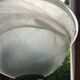 Half bell wall light in milky glass