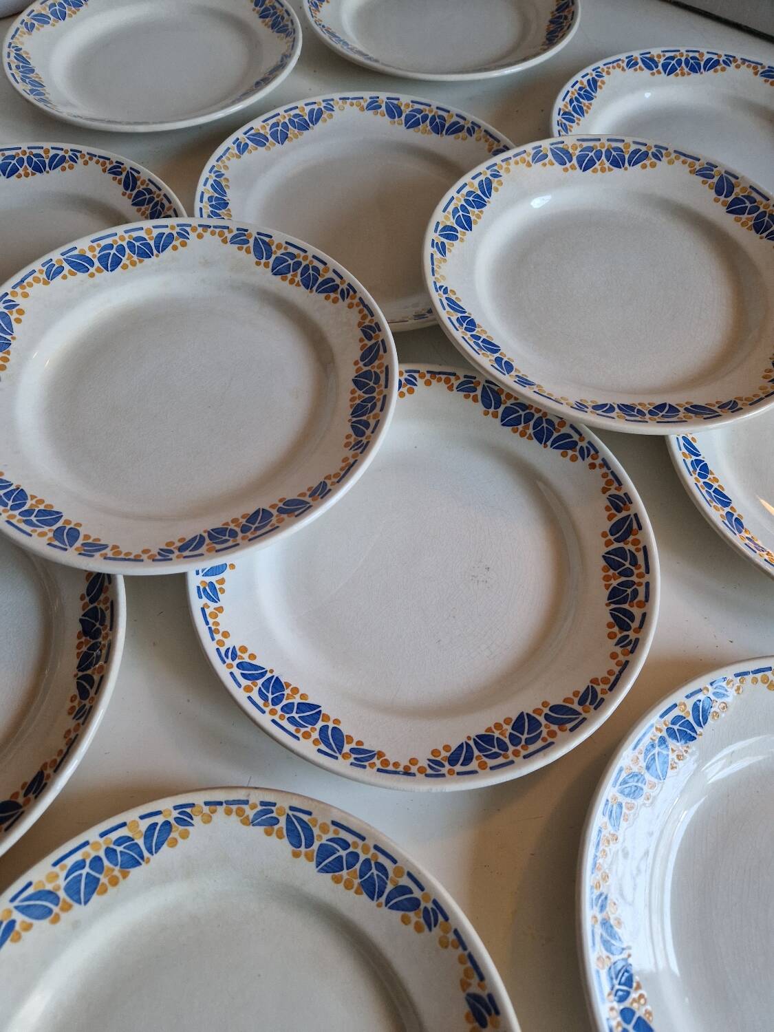 Set of 12 antique Art Deco plates, earthenware from Creil Montereau.