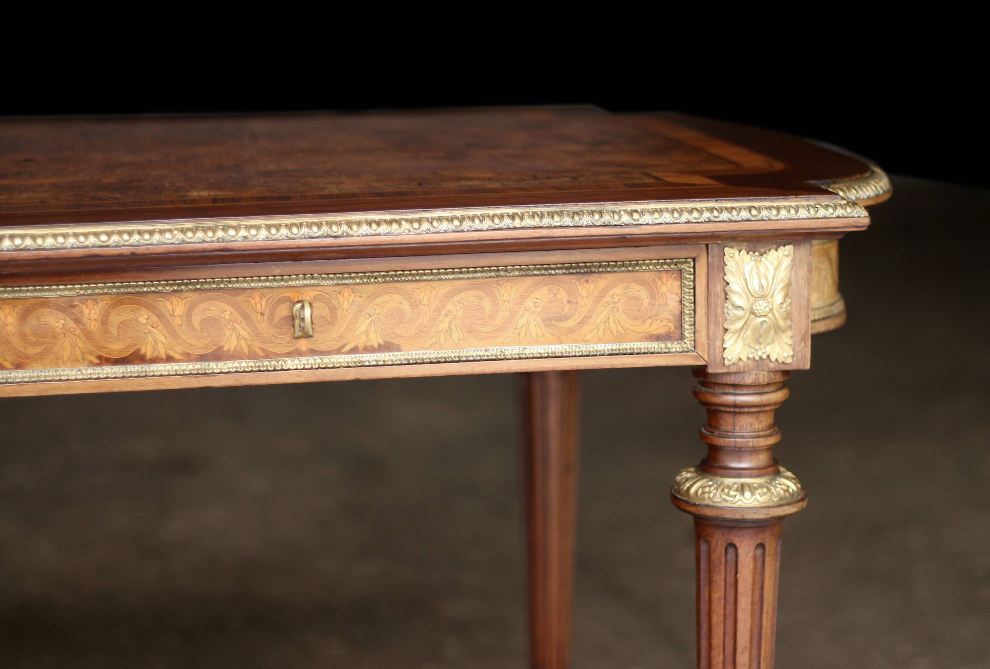 Superb Napoleon III table. Marquetry top and gilded bronzes.