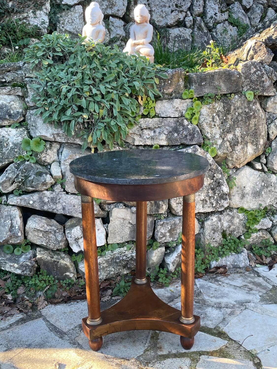 Empire style mahogany and mahogany veneer tripod pedestal table