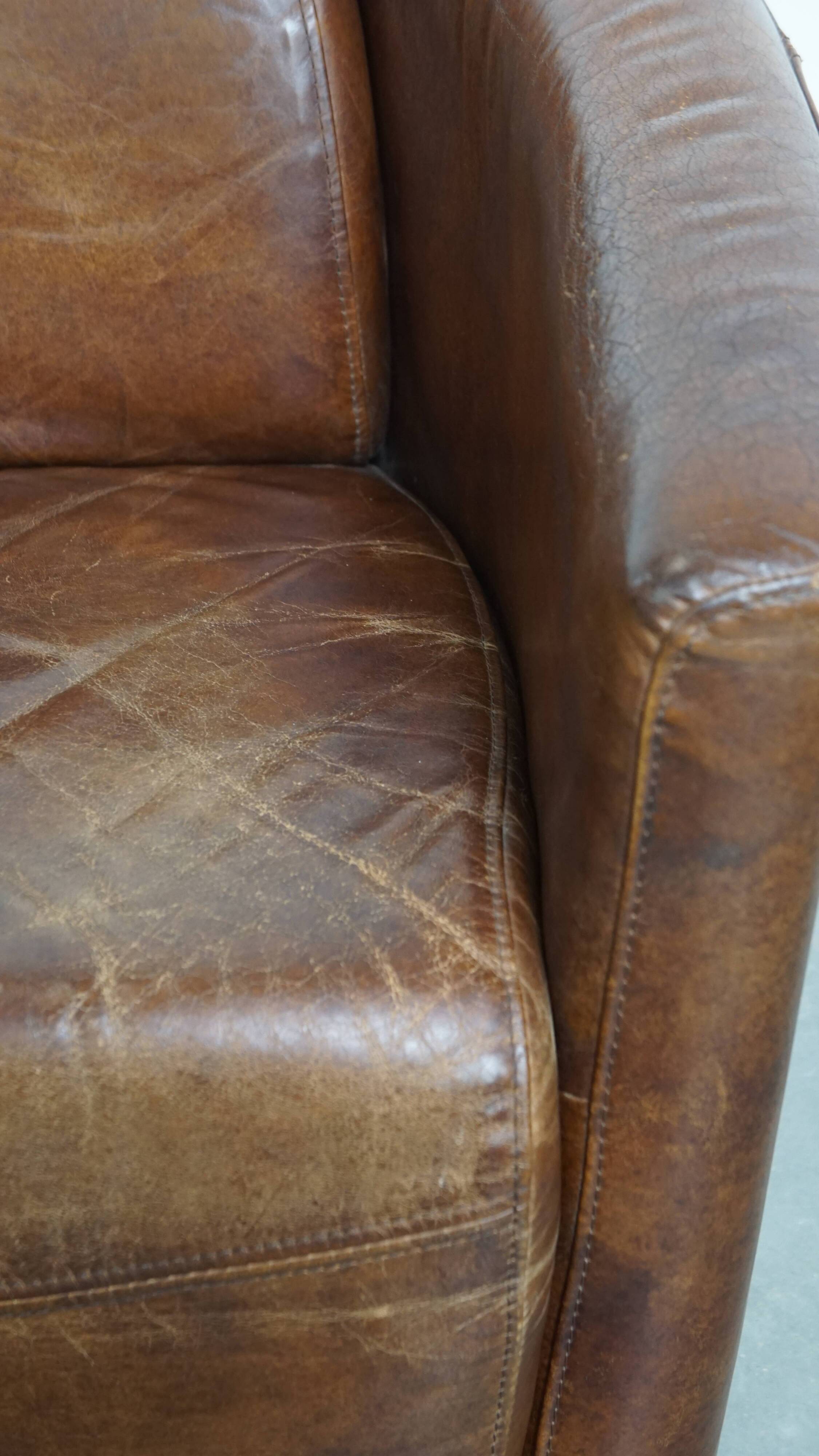 Brown Aviator design armchair made of cowhide leather