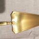 Old vermeil pie shovel, silver handle in his box