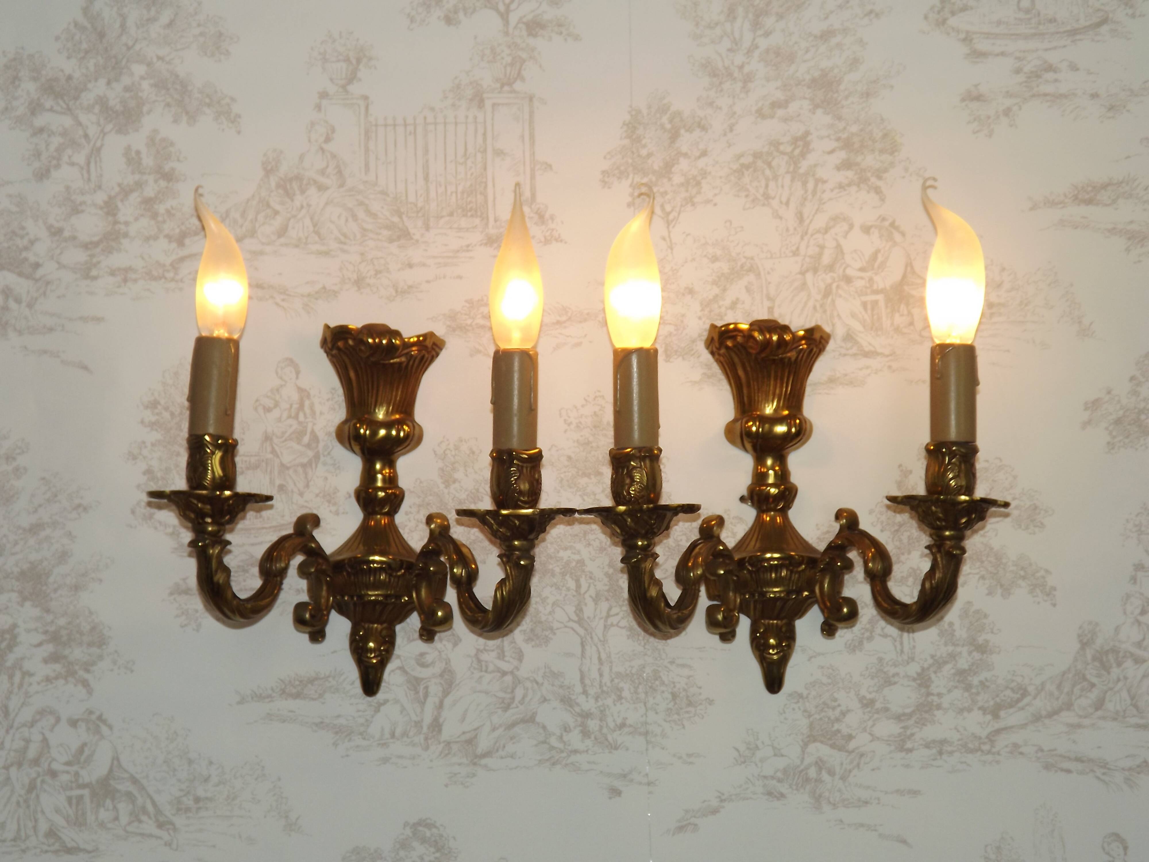 Pair of French baroque brass wall sconces with two branches, decorated with acanthus and wickerwork.