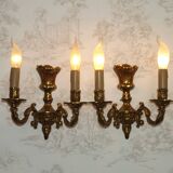 Pair of French baroque brass wall sconces with two branches, decorated with acanthus and wickerwork.