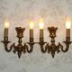 Pair of French baroque brass wall sconces with two branches, decorated with acanthus and wickerwork.