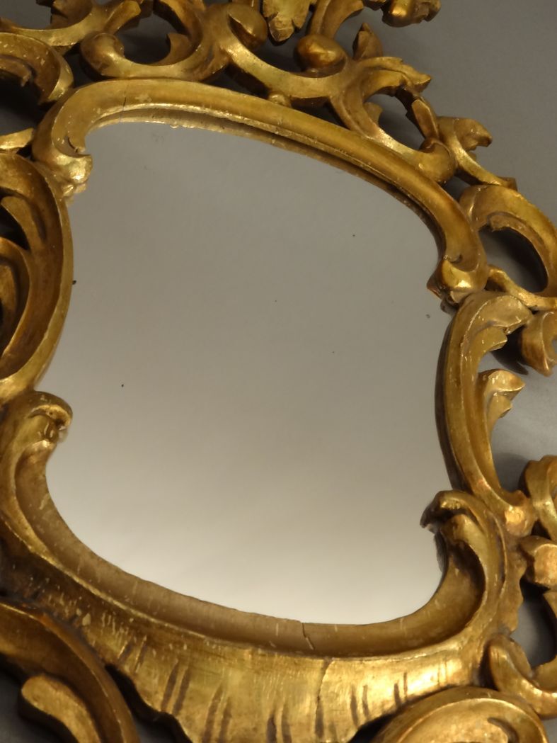 Carved and gilded wooden mirror with gold leaf 46 x 103 cm