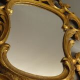 Carved and gilded wooden mirror with gold leaf 46 x 103 cm