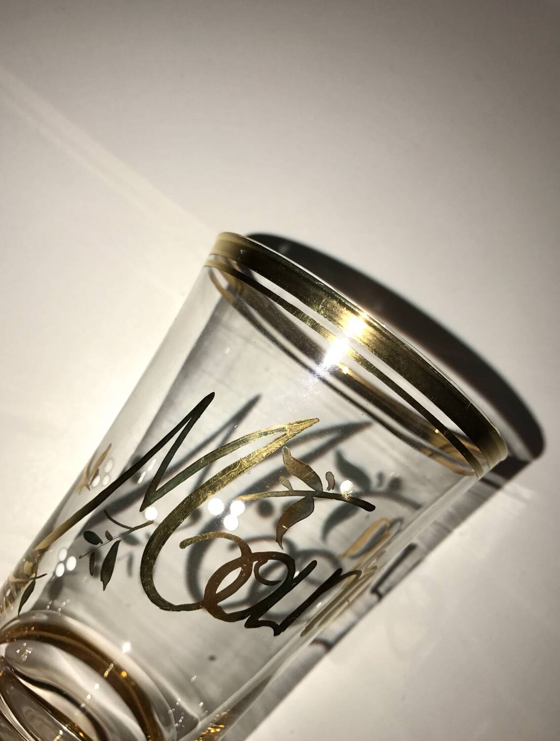 Antique gilded glass with the inscription Maman