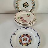 Set of 8 ironstone plates with coordinated designs.