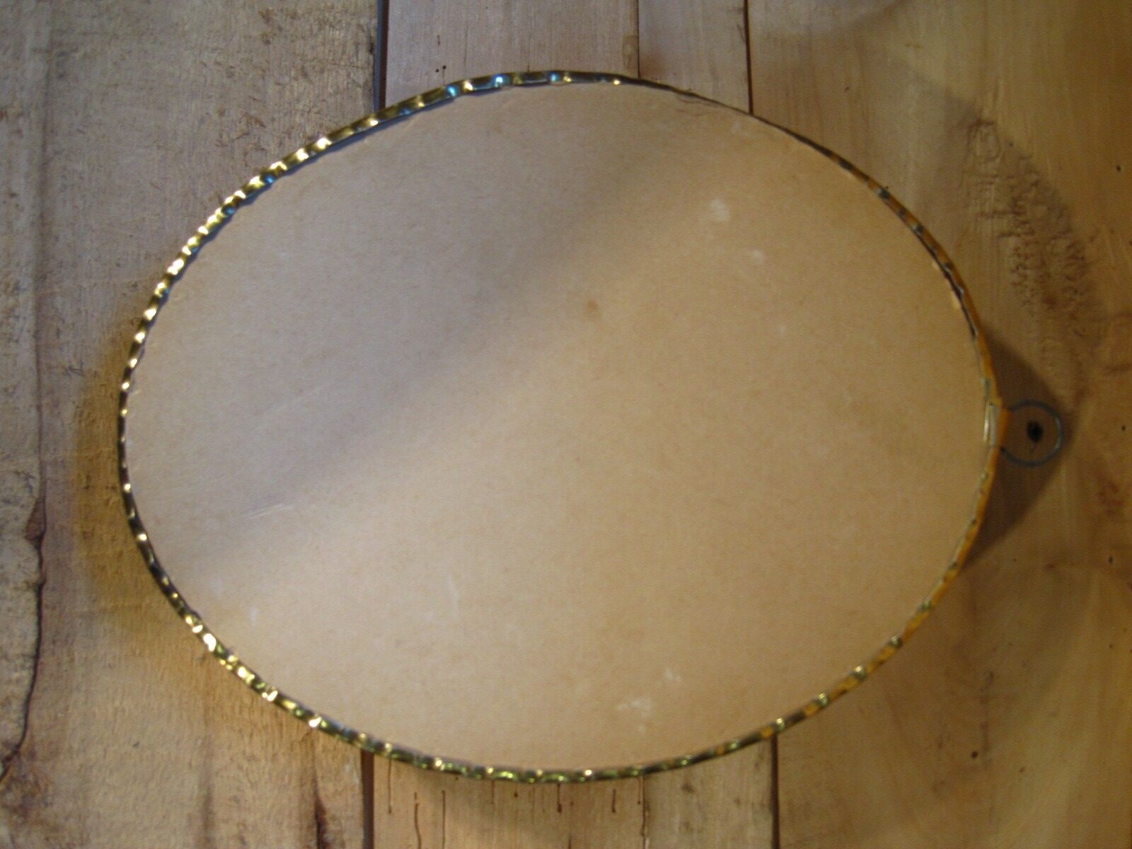 Curved oval frame with blue butterfly