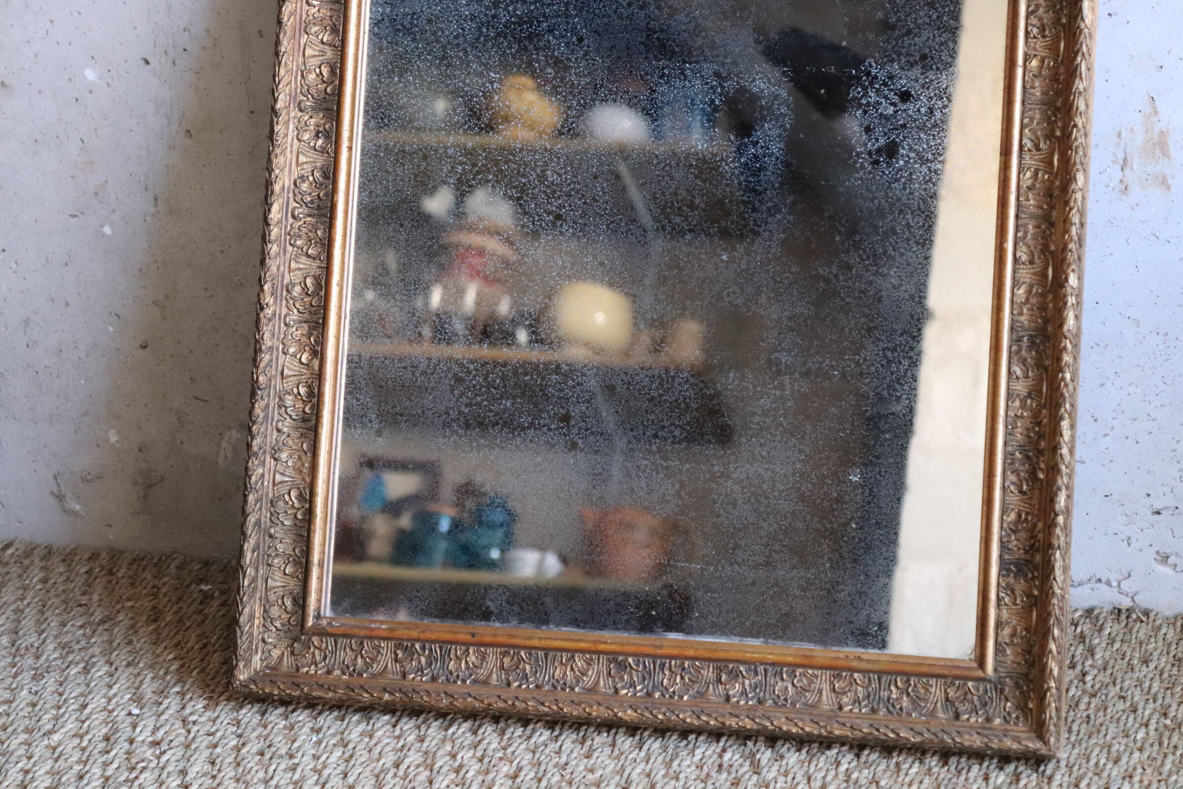 Antique mirror in wood and stucco