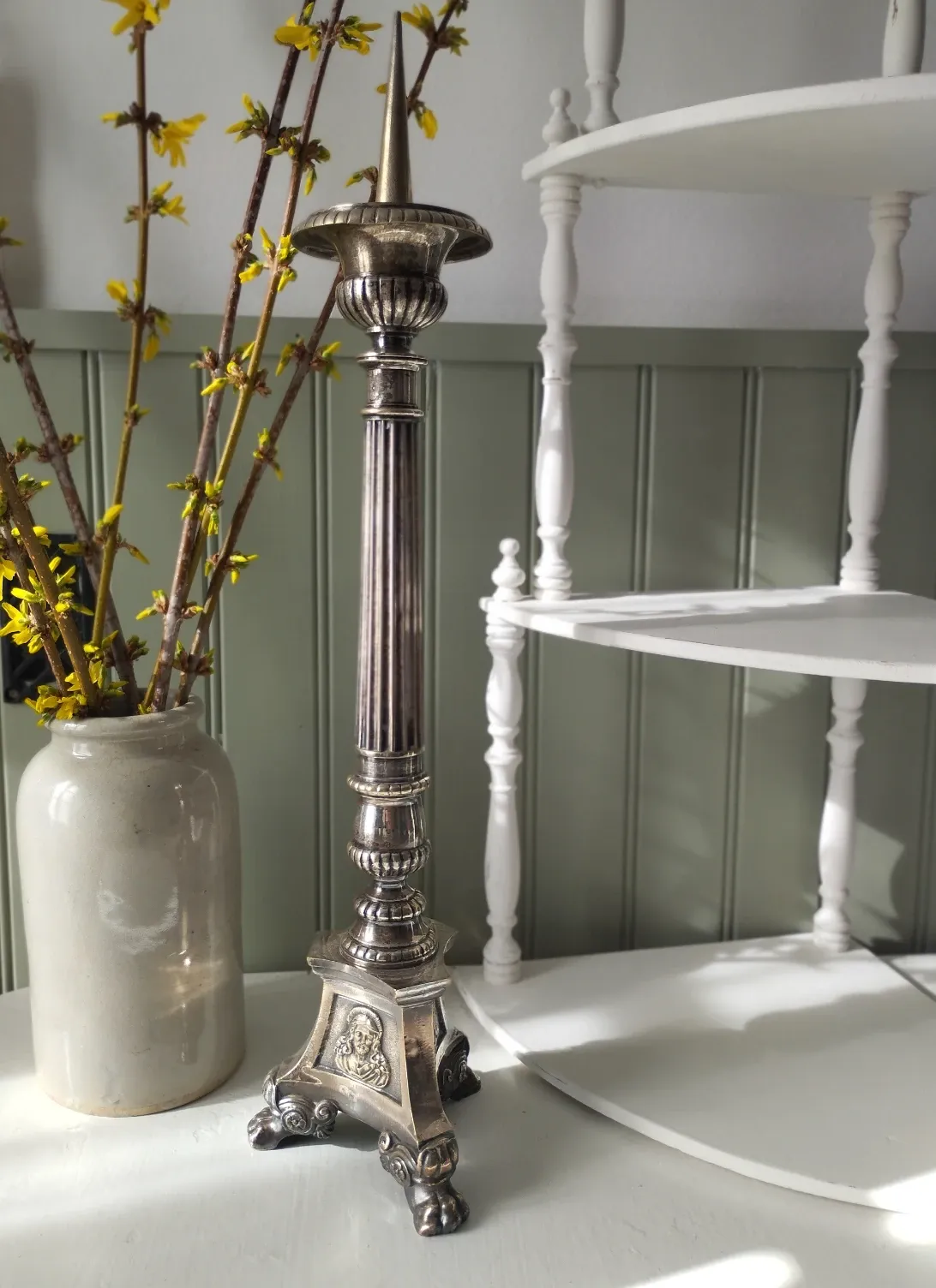 Old church candlestick in silver-plated metal