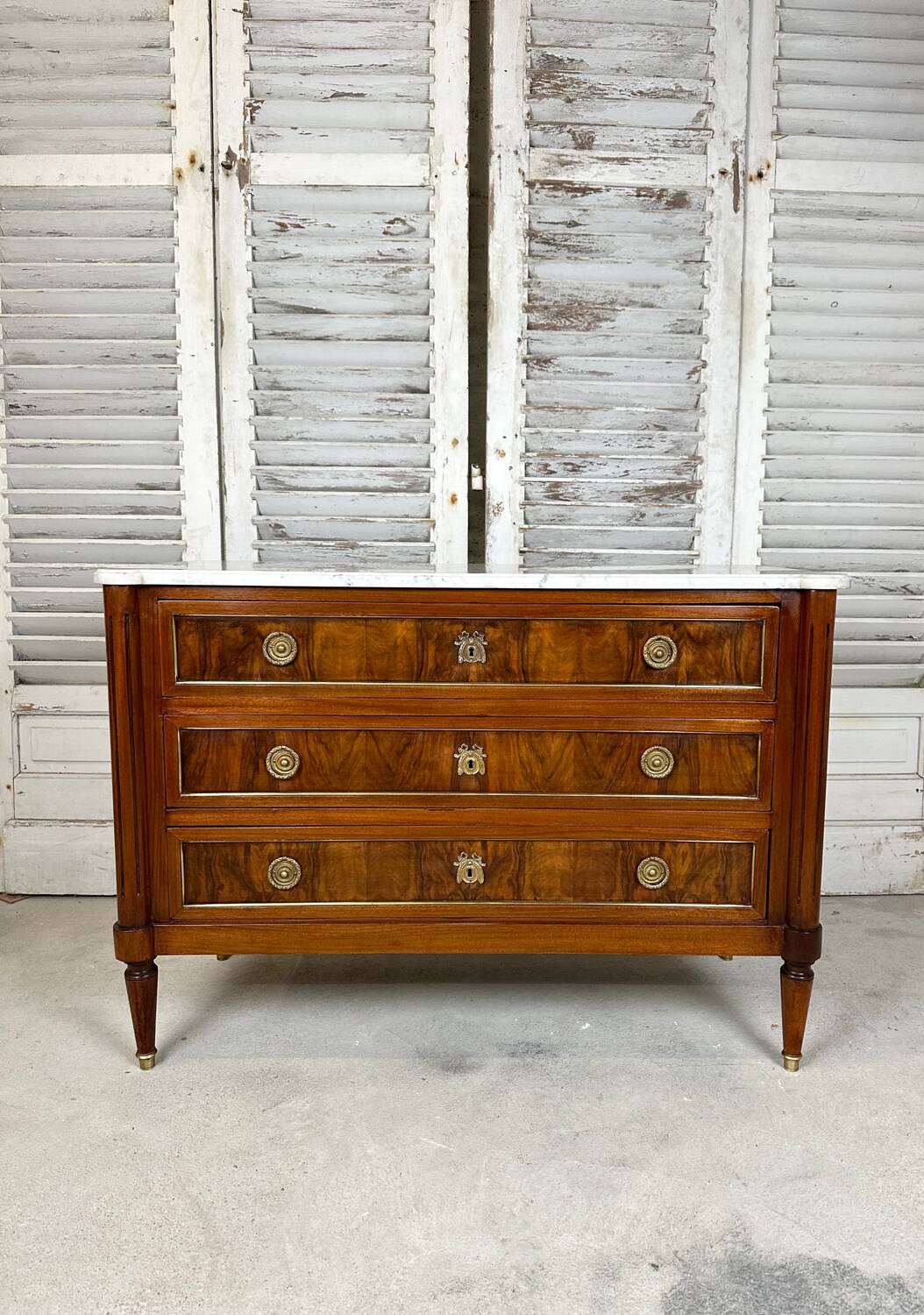 Louis XVI style chest of drawers in mahogany and walnut