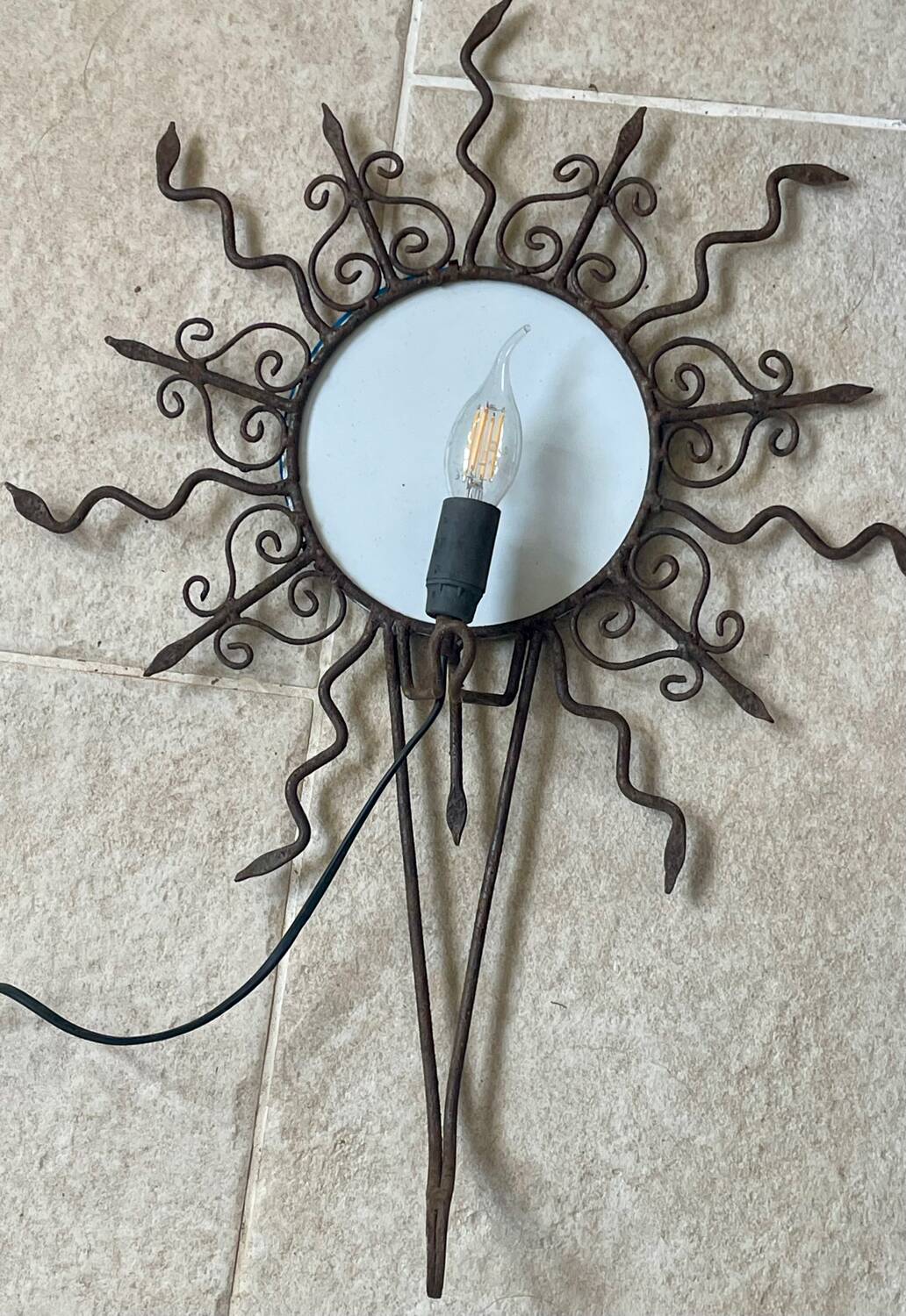 Luminous wrought iron sun mirror