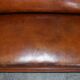 Victorian Chesterfield leather canapé with oak lion claw feet.