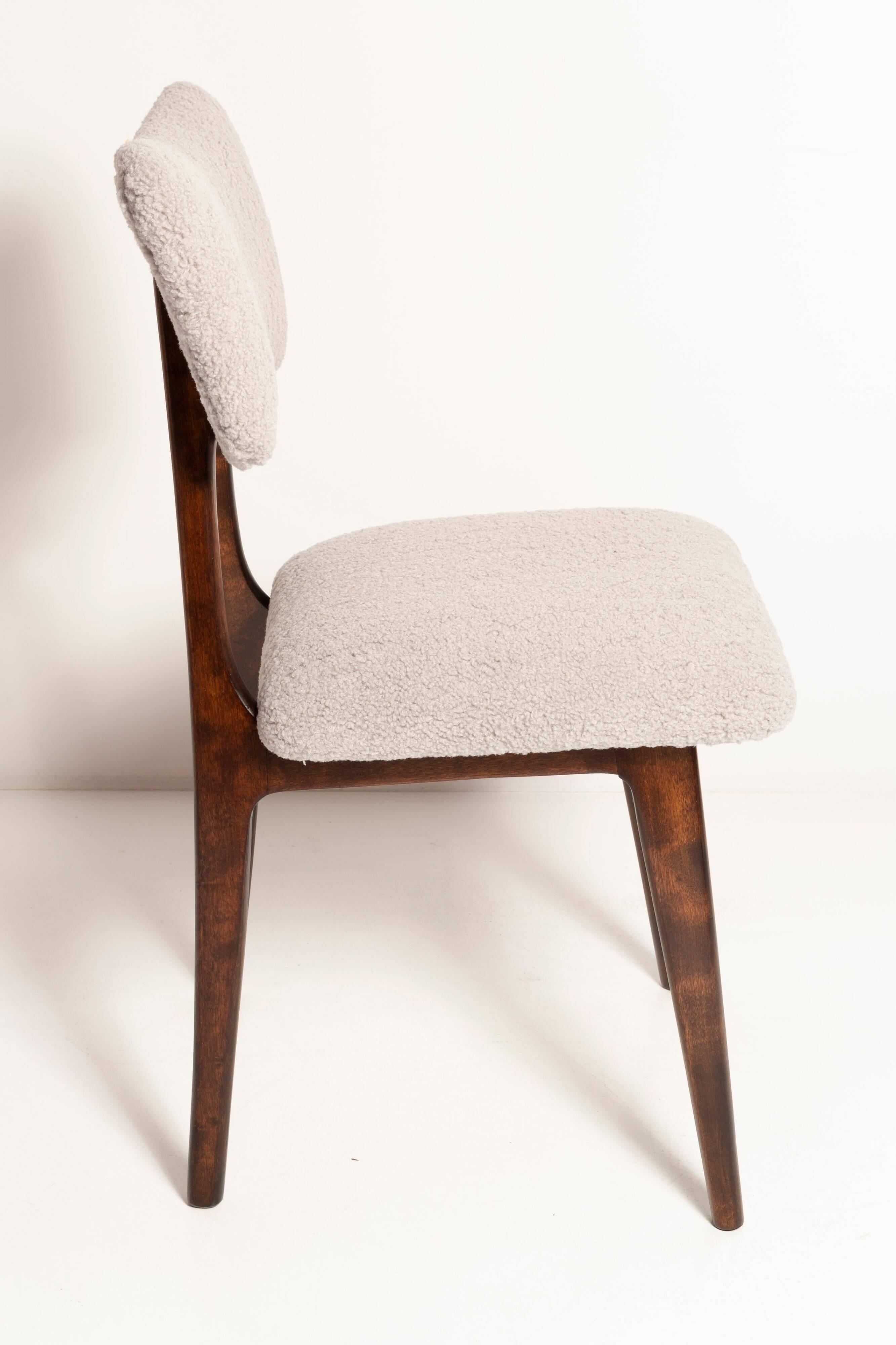 Mid-century butterfly chair, light grey boucle, dark walnut wood, Europe, 1960s.