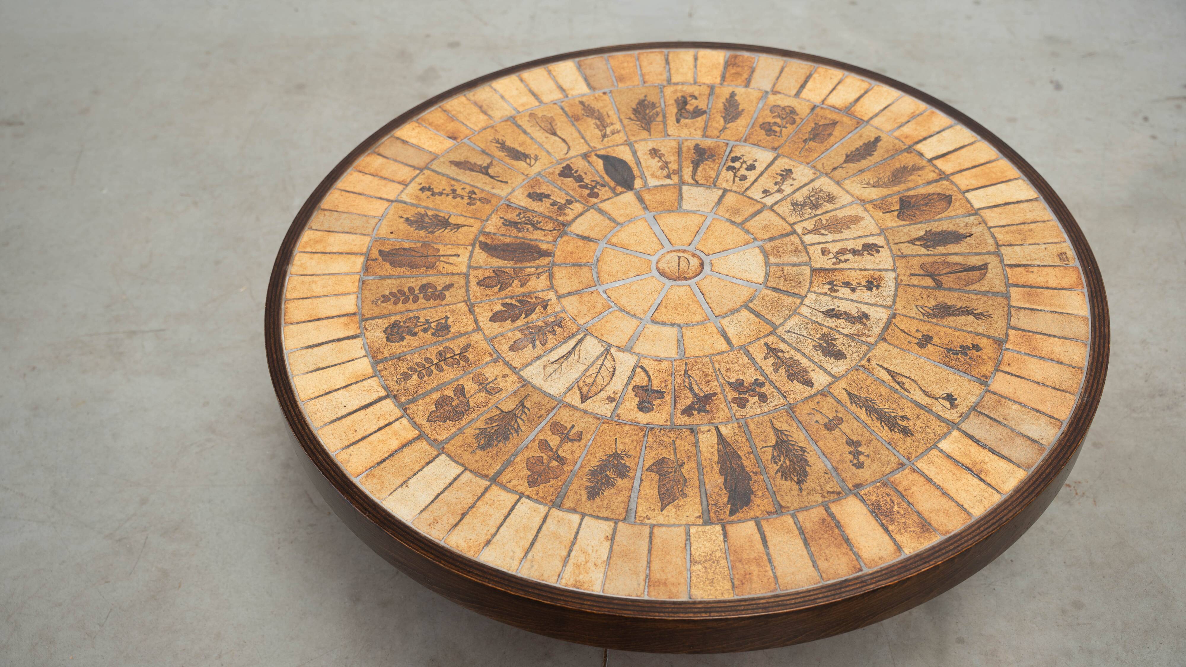 Round coffee table by Roger Capron