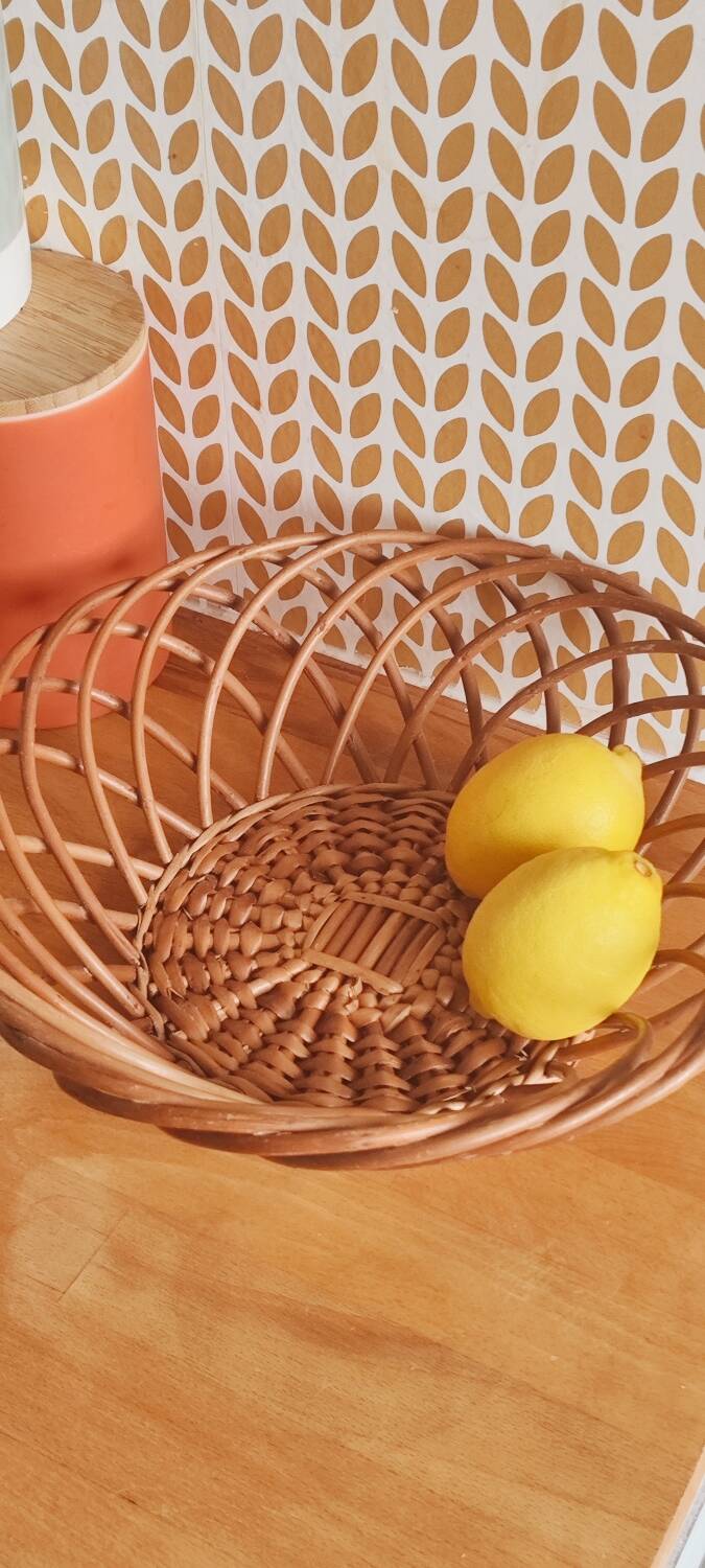Vintage woven wicker round basket for fruits or bread.