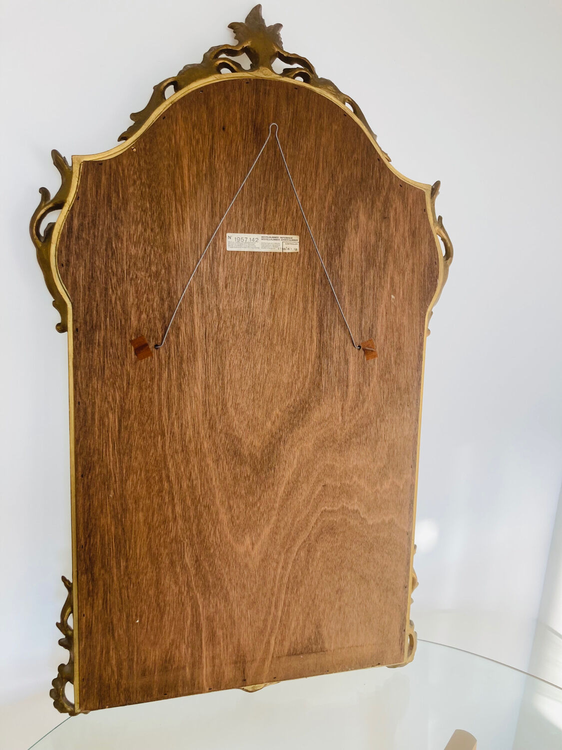 Large golden mirror parecloses