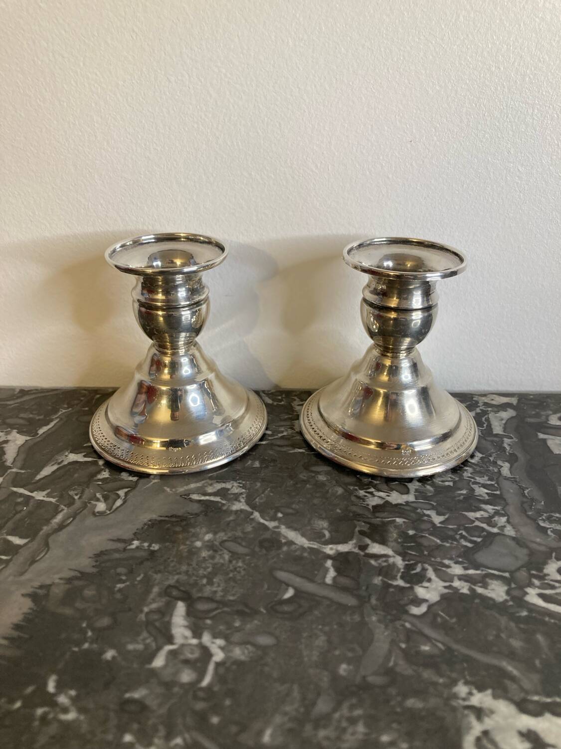 Pair of silver metal candlesticks