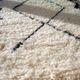 Berber carpet Béni Ouarain black and white with diamonds and braided border