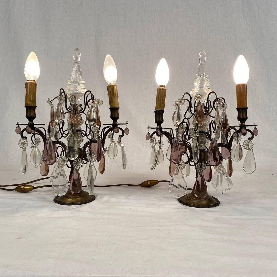 Pair of bronze chandeliers with tassels