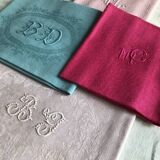 Suite of four antique tinted napkins