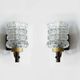 Pair of wall sconces in textured glass, wood, and gold metal, 1970.