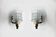 Pair of wall sconces in textured glass, wood, and gold metal, 1970.